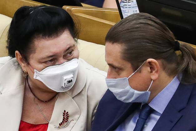 MOSCOW, RUSSIA - APRIL 14, 2020: Russian State Duma members wear face masks during a State Duma plenary meeting. Anton Novoderezhkin TASS  TS0D5AB1