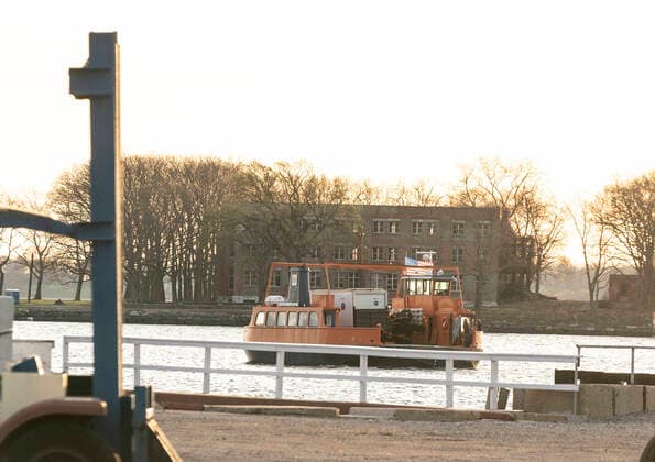NYC buries unclaimed COVID-19 bodies on Hart Island Ferry carrying Medical Examiner refrigerated truck seen moving from City Island to Hart Island where unclaimed COVID-19 bodies are buried New York New York United States Copyright: LevxRadin