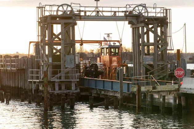 NYC buries unclaimed COVID-19 bodies on Hart Island Ferry carrying Medical Examiner refrigerated truck and other equipment is seen docked at City Island in route to Hart Island where unclaimed COVID-19 bodies are buried New York New York United States Copyright: LevxRadin
