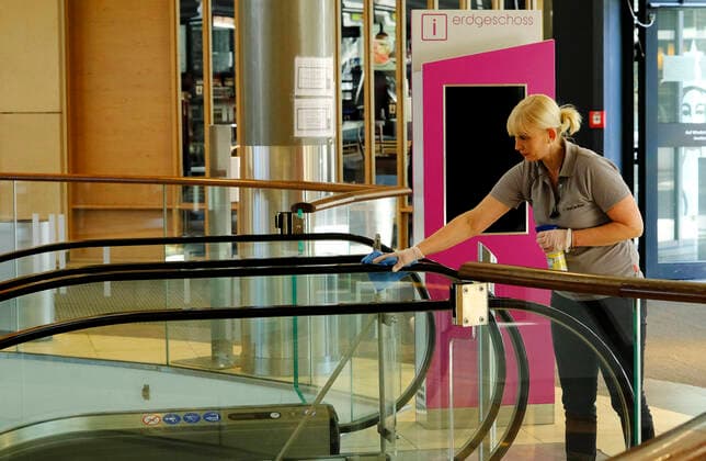 Germany Rheinland Pfalz Kaiserslautern Coronakrise pedestrian zone shopping centre disinfection of escalator Corona