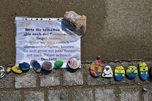 In Regensburg children paint pebbles and lay them on the ground along the Danube near Schwabelweis After the Corona Pandemic people are allowed to help themselves and take their favourites home with them Photo Painted stones