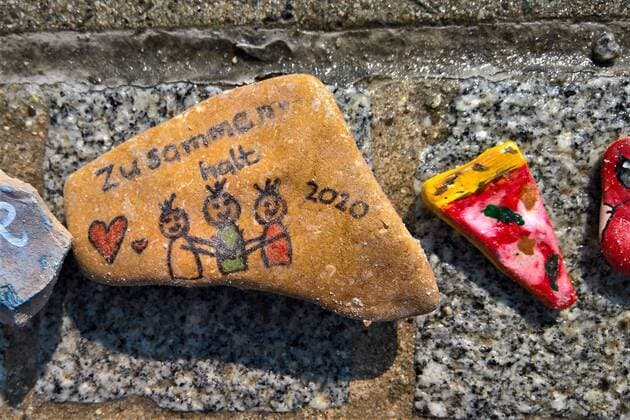 In Regensburg, children paint pebbles and lay them on the ground along the Danube near Schwabelweis After the Corona Pandemic, people are allowed to help themselves and take their favourites home with them Photo Painted stones Cohesion 2020