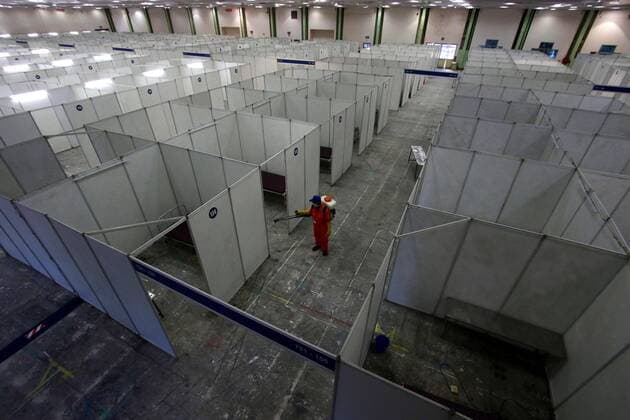 (200414) -- CHENNAI, April 14, 2020 (Xinhua) -- A municipal worker sprays disinfectant at a makeshift isolation hospital for COVID-19 patients in Chennai, India, April 14, 2020. India s health ministry Tuesday evening said the death toll due to COVID-19 in India has risen to 353 and the total number of confirmed cases in the country reached 10,815. (Str Xinhua) INDIA-CHENNAI-CORONAVIRUS 