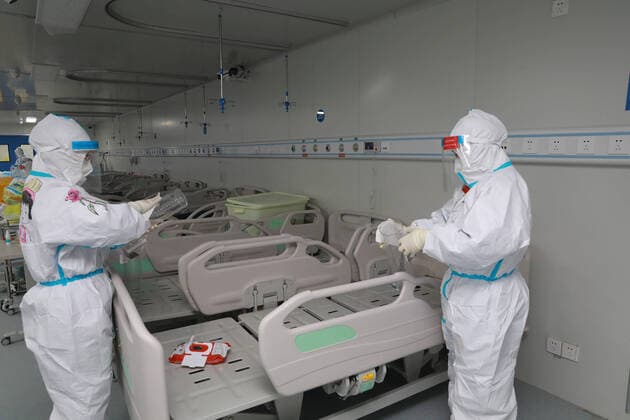 (200414) -- WUHAN, April 14, 2020 (Xinhua) -- Medical staff disinfect wards at the Leishenshan hospital in Wuhan, central China s Hubei Province, April 14, 2020. The last batch of COVID-19 patients at the Leishenshan hospital were transferred on Tuesday to other hospitals in Wuhan. (Photo by Gao Xiang Xinhua) CHINA-WUHAN-COVID-19-LEISHENSHAN HOSPITAL-PATIENTS-TRANSFER (CN) 