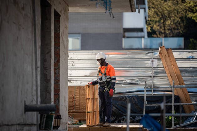 April 14, 2020, Girona, Spain: A man works at a construction site in the center of Girona wearing a protection mask during he s first day of work after the lock down restriction lift..Some industries and construction sectors in Catalonia resume work as the lockdown restrictions have been changed. Health Ministry of Spain has so far recorded a total of 170,099 infections, 17,756 death and 64,727 recovered since the beginning of the corona virus outbreak. Girona Spain - ZUMAs197 20200414_zaa_s197_065 Copyright: xAdriÃ xSalidoxZarcox