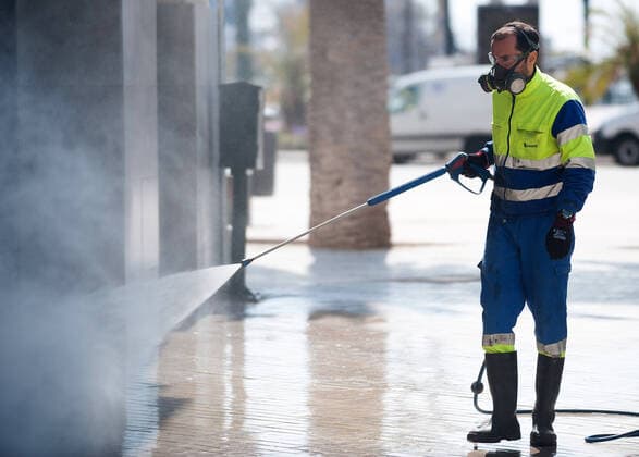 April 14, 2020, Malaga, Spain: A street cleaner is seen disinfecting a street amid coronavirus outbreak..Spaniards get back to their jobs after finishing the standstill of all work activities and services not essential due to the alarm state caused by the outbreak of coronavirus disease (COVID-19) in Spain. Malaga Spain - ZUMAs197 20200414_zaa_s197_078 Copyright: xJesusxMeridax