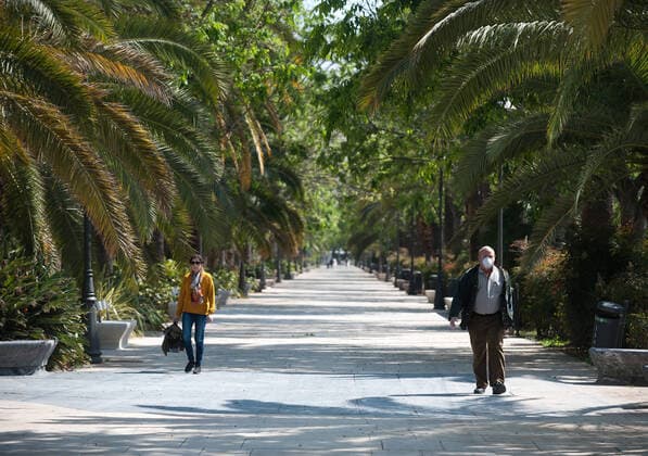 April 14, 2020, Malaga, Spain: People walking on a empty promenade due to the confinement regulations amid coronavirus outbreak..Spaniards get back to their jobs after finishing the standstill of all work activities and services not essential due to the alarm state caused by the outbreak of coronavirus disease (COVID-19) in Spain. Malaga Spain - ZUMAs197 20200414_zaa_s197_080 Copyright: xJesusxMeridax