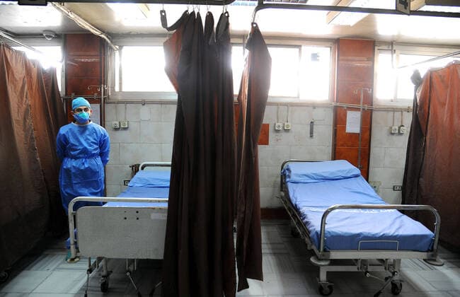 (200414) -- DAMASCUS, April 14, 2020 -- A medical worker is seen in an isolation unit at the Mujtahid hospital in Damascus, capital of Syria, on April 14, 2020. Four new COVID-19 cases were reported in Syria on Tuesday, bringing the overall number of registered cases to 29, the health ministry said in a statement. (Photo by Xinhua) SYRIA-DAMASCUS-COVID19-HOSPITAL AmmarxSafarjalani 
