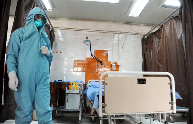 (200414) -- DAMASCUS, April 14, 2020 -- A medical worker is seen in an isolation unit at the Mujtahid hospital in Damascus, capital of Syria, on April 14, 2020. Four new COVID-19 cases were reported in Syria on Tuesday, bringing the overall number of registered cases to 29, the health ministry said in a statement. (Photo by Xinhua) SYRIA-DAMASCUS-COVID19-HOSPITAL AmmarxSafarjalani 