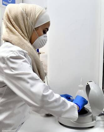 (200414) -- DAMASCUS, April 14, 2020 -- A laboratorian works on a test for COVID-19 virus at a laboratory in Damascus, capital of Syria, on April 14, 2020. Four new COVID-19 cases were reported in Syria on Tuesday, bringing the overall number of registered cases to 29, the health ministry said in a statement. (Photo by Xinhua) SYRIA-DAMASCUS-COVID19-TEST AmmarxSafarjalani 