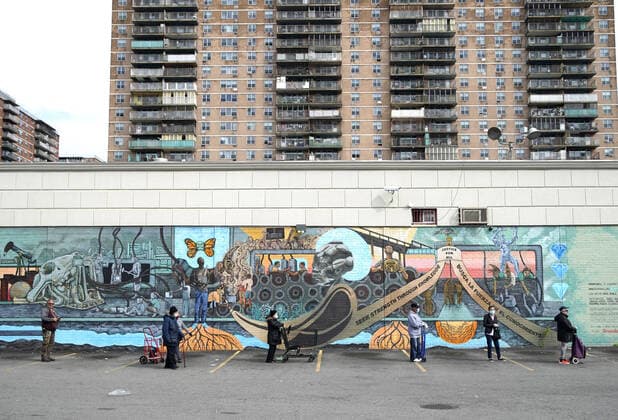 People wait on line to enter a super market wearing protective face masks and practicing social distancing in New York City on Tuesday, April 14, 2020. As of today nearly 285,000 have been infected with Coronavirus and more than 14,000 people have died in NY, NJ and CT. There are signs however that the curve is flattening.  NYP20200414112 JOHNxANGELILLO