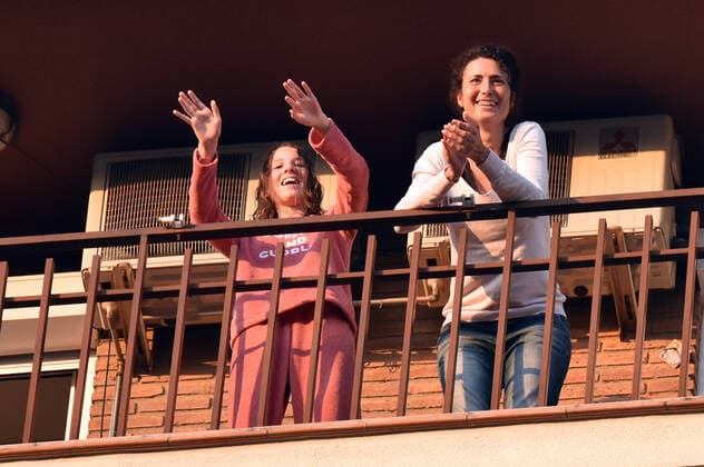 April 14, 2020, LÂ Hospitalet, Barcelona, Spain: People applaud Covid-19 fighters from their terrace during confinement..Citizens of LÂ Hospitalet at 8:00 pm continue to applaud showing gratitude to the people who are struggling in the fight against the Covid-19 health crisis, they give each other hope. LÂ Hospitalet Spain - ZUMAs197 20200414_zaa_s197_131 Copyright: xRamonxCostax