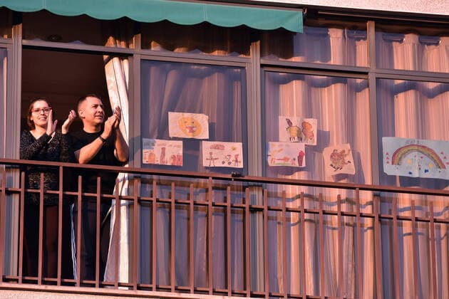April 14, 2020, LÂ Hospitalet, Barcelona, Spain: People applaud Covid-19 fighters from their terrace during confinement..Citizens of LÂ Hospitalet at 8:00 pm continue to applaud showing gratitude to the people who are struggling in the fight against the Covid-19 health crisis, they give each other hope. LÂ Hospitalet Spain - ZUMAs197 20200414_zaa_s197_135 Copyright: xRamonxCostax