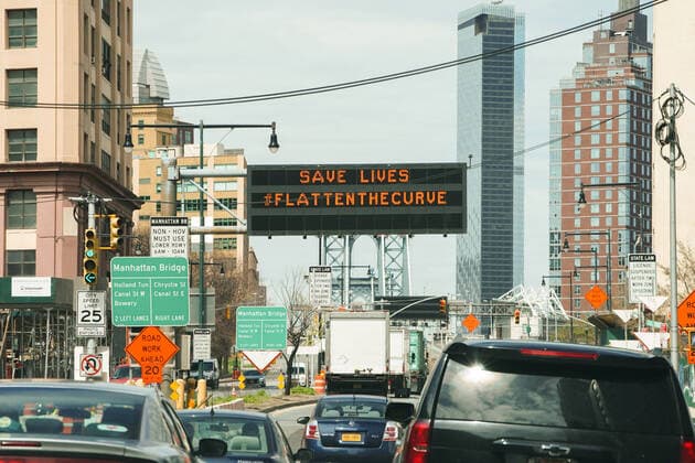 April 14, 2020, New York, NY, USA: A traffic sign urging people to stay home and flatten the curve at the entrance to the Manhattan Bridge in the Borough of Brooklyn on April 14, 2020 in New York. New York USA - ZUMAb148 20200414_zap_b148_022 Copyright: xBryanxSmithx