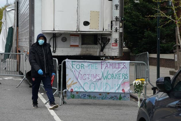April 14, 2020, New York, NY, USA: A sign for the victims of COVID-19 hangs near a refrigeration trailer serving as a temporary morgue outside of Brooklyn Hospital Center in the Borough of Brooklyn on April 14, 2020 in New York. New York USA - ZUMAb148 20200414_zap_b148_025 Copyright: xBryanxSmithx