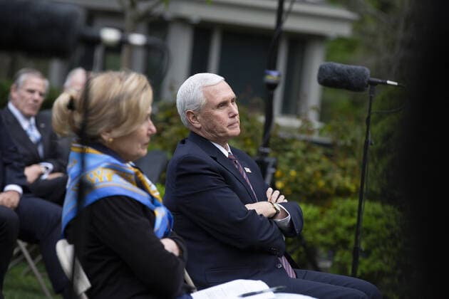 Vice President Mike Pence listens as United States President Donald J. Trump delivers remarks during a news conference in the Rose Garden of the White House in Washington, DC on Tuesday, April 14, 2020. Trump announced that he has instructed his administration to halt funding to the World Health Organization (WHO).  WAX20200414225 STEFANIExREYNOLDS