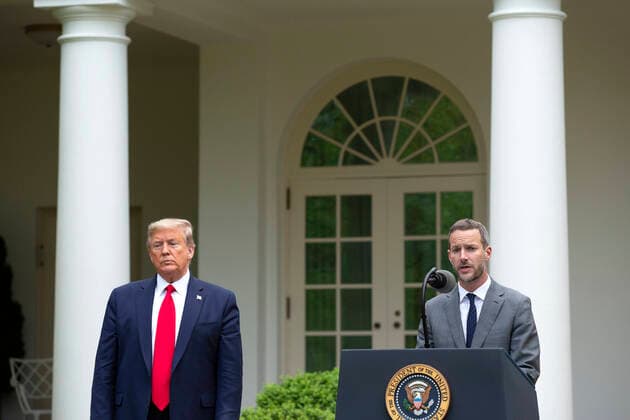 April 14, 2020, Washington, District of Columbia, USA: United States President Donald J. Trump, left, listens as Adam Boehler, CEO of U.S. International Development Finance Corporation, delivers remarks during a news conference in the Rose Garden of the White House in Washington D.C., U.S. on Tuesday, April 14, 2020. Trump announced that he has instructed his administration to halt funding to WHO, the World Health Organization. Washington USA - ZUMAs152 20200414_zaa_s152_090 Copyright: xStefanixReynoldsx