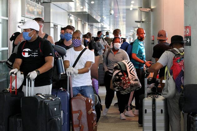April 14, 2020, Miami, FL, USA: A group of South Africans nationals arrive at Miami International Airport to board a special charter flight by South African Airways on Tuesday, April 14, 2020. Amid the coronavirus pandemic, the flight will repatriate more than 300 South African workers who were supposed to spend these months working at South Florida hotels and resorts. Miami USA - ZUMAm67_ 20200414_zaf_m67_029 Copyright: xPedroxPortalx