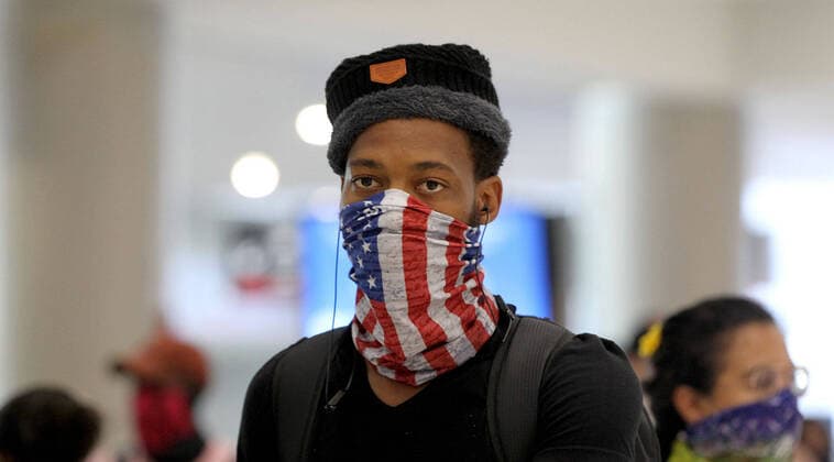 April 14, 2020, Miami, FL, USA: David Naldvu an employee at the Boca Whisk resort was among a group of South African nationals at Miami International Airport boarding a special charter flight by South African Airways on Tuesday, April 14, 2020. Amid the coronavirus pandemic, the flight will repatriate more than 300 South African workers who were supposed to spend these months working at South Florida hotels and resorts. Miami USA - ZUMAm67_ 20200414_zaf_m67_033 Copyright: xPedroxPortalx