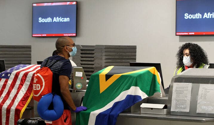 April 14, 2020, Miami, FL, USA: Rosemary Arends, an assistant nurse-flight attendant, checks the temperature of passengers and then helps a group of South African nationals at Miami International Airport boarding a special charter flight by South African Airways on Tuesday, April 14, 2020. Amid the coronavirus pandemic, the flight will repatriate more than 300 South African workers who were supposed to spend these months working at South Florida hotels and resorts. Miami USA - ZUMAm67_ 20200414_zaf_m67_035 Copyright: xPedroxPortalx