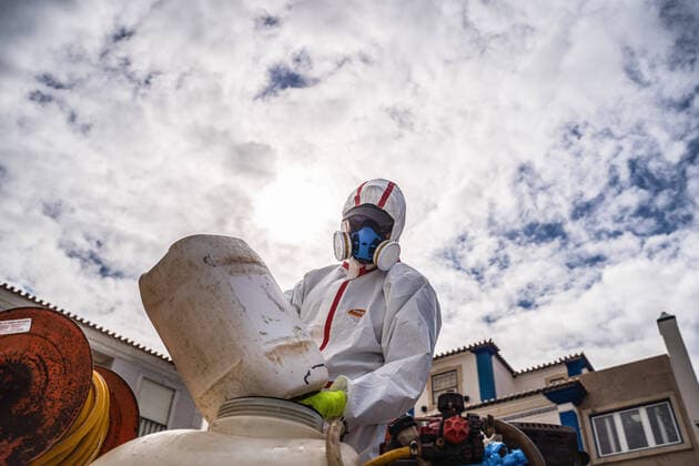 April 14, 2020, Ericeira, Portugal: An employee of the Ericeira parish council, equipped with the recommended protective materials, prepares the solution based on hypochlorite (bleach), for disinfecting the street..The municipality of Mafra had 70 cases of COVID-19 pandemic. In order to prevent the spread of the virus, the Ericeira Parish Council perform weekly street disinfection. Ericeira Portugal - ZUMAs197 20200414_zaa_s197_183 Copyright: xHenriquexCasinhasx