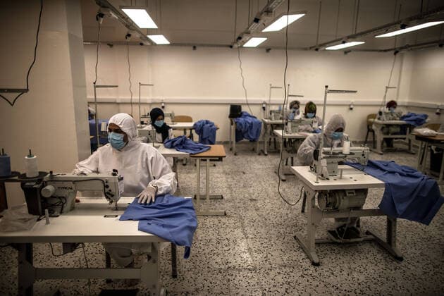 (200415) -- TRIPOLI, April 15, 2020 (Xinhua) -- Workers make protective suits in a fashion school which was turned into a workshop producing protective gears in Tripoli, Libya, on April 14, 2020. The Libyan National Center for Disease Control on Tuesday announced nine new COVID-19 cases, bringing the total number of confirmed cases in the country to 35. (Photo by Amru Salahuddien Xinhua) LIBYA-TRIPOLI-COVID-19-PROTECTIVE WORKSHOP 