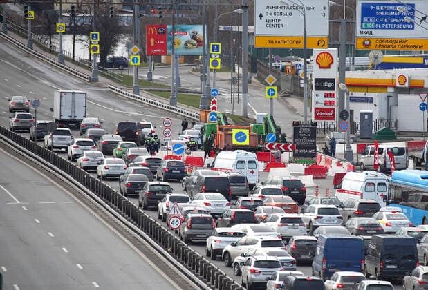 MOSCOW, RUSSIA - APRIL 15, 2020: A traffic congestion at a checkpoint on Leningradskoye Shosse Motorway at the entrance to Moscow during the pandemic of the novel coronavirus disease (COVID-19). Traffic police have set up checkpoints around the city to stop vehicles and see if drivers have permission to travel during the lockdown. On 13 April 2020, the Moscow government introduced a digital permit system aimed at further restricting movement. Under the new scheme, which becomes mandatory from 15 April, people need to apply for permits to travel on a vehicle or public transport around the city. Earlier, on 11 April, the Moscow government restricted vehicles registered outside Moscow Region from entering the Russian capital. Since 30 March 2020, Moscow has been on lockdown. As of 15 April 2020, Russia has reported more than 21,100 confirmed TS0D5C84