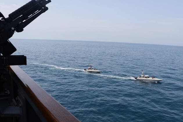 Iranian Islamic Revolutionary Guard Corps Navy (IRGCN) vessels conducted unsafe and unprofessional actions against U.S. Military ships by crossing the ships bows and sterns at close range while operating in international waters of the North Arabian Gulf on April 15, 2020. The guided-missile destroyer USS Paul Hamilton (DDG 60) is conducting joint interoperability operations in support of maritime security in the U.S. 5th Fleet area of operations.  WAX2020041503 U.S.xNAVY