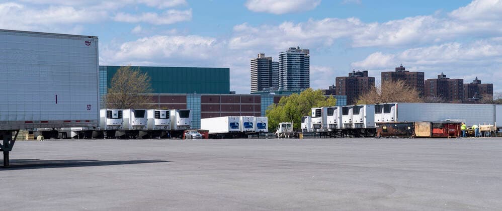 Live in New York amid COVID-19 epidemic Dozens of refrigerated trucks and containers seen on Randall s Island prepared for influx of dead bodies as makeshift morgues amid COVID-19 pandemic New York New York United States Copyright: LevxRadin