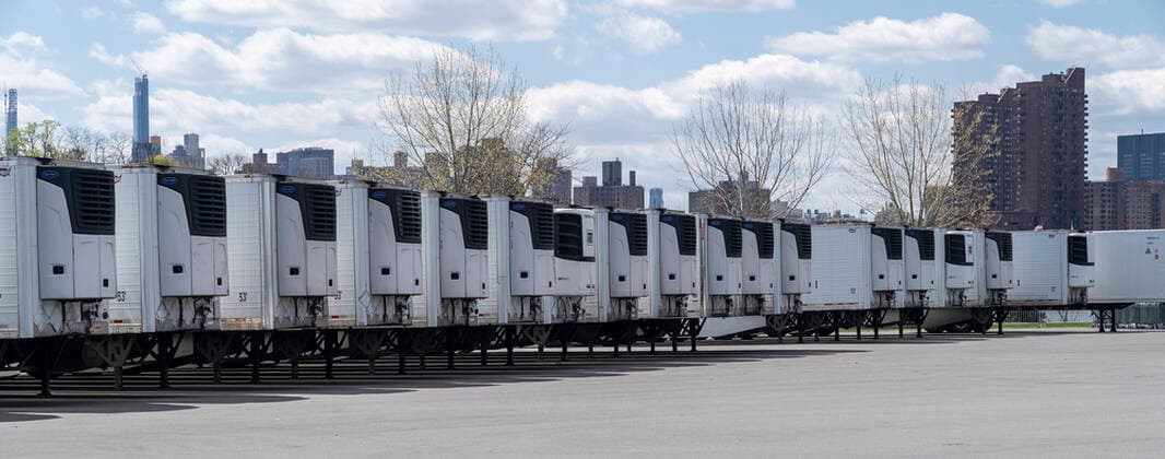 Live in New York amid COVID-19 epidemic Dozens of refrigerated trucks and containers seen on Randall s Island prepared for influx of dead bodies as makeshift morgues amid COVID-19 pandemic New York New York United States Copyright: LevxRadin