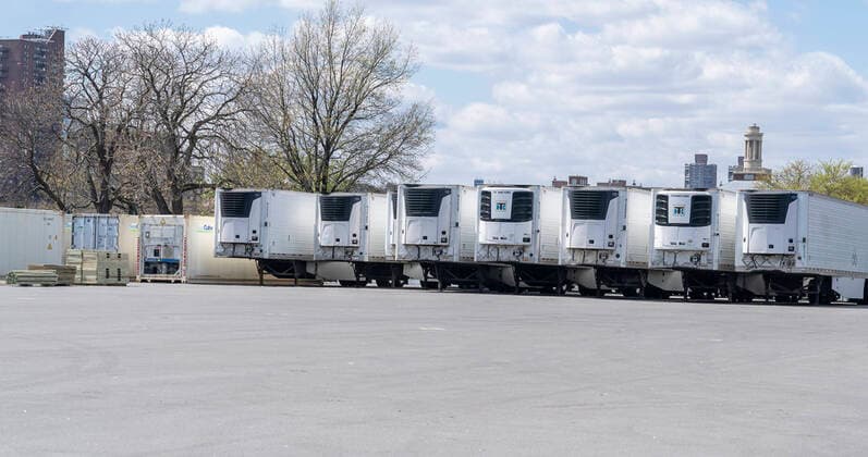 Live in New York amid COVID-19 epidemic Dozens of refrigerated trucks and containers seen on Randall s Island prepared for influx of dead bodies as makeshift morgues amid COVID-19 pandemic New York New York United States Copyright: LevxRadin