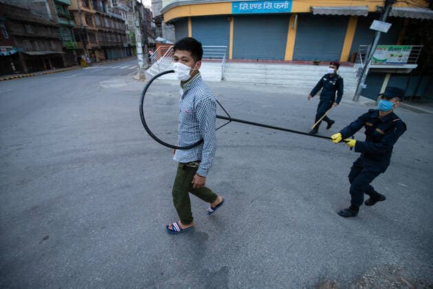 Nepal: 23rd day Nationwide lockdown amid COVID-19 A Nepalese police officer maintains distance as he detains a man defying the lockdown on the 23rd day of a government imposed lockdown amid concerns over the spread of COVID-19 contagion in Kathmandu, Nepal on Wednesday, April 15, 2020.Nepal government extended the national wide lock down until 27 April, the number of COVID-19 patients has reached 16. Kathmandu Nepal Copyright: PrabinxRanabhat