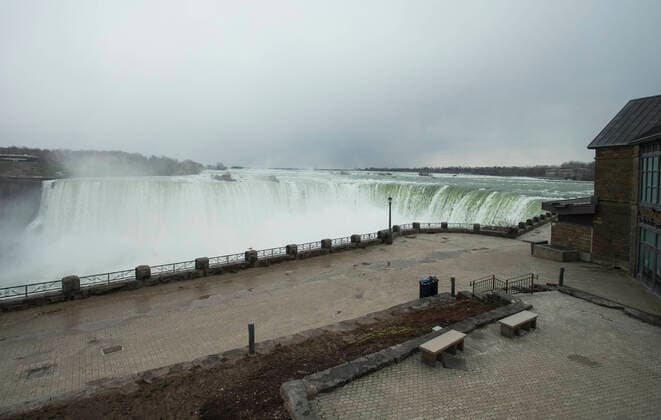 (200415) -- NIAGARA FALLS, April 15, 2020 -- Niagara Falls with no visitors is seen from the Canadian side in Niagara Falls, Ontario, Canada, on April 15, 2020. Canadian Prime Minister Justin Trudeau announced Wednesday expanded eligibility rules for the Canada Emergency Response Benefit (CERB) so that part-time and seasonal workers can claim the CERB. As of Wednesday afternoon, there were 28,206 confirmed COVID-19 cases and 1,007 deaths across the country. (Photo by Xinhua) CANADA-ONTARIO-NIAGARA FALLS-COVID-19-ECONOMY ZouxZheng 