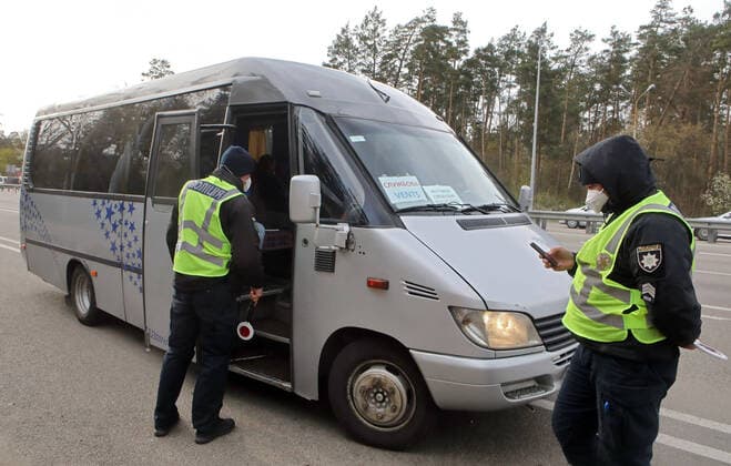 KYIV REGION, UKRAINE - APRIL 15, 2020 - Officers of the National Police are seen on duty at the quarantine security checkpoint outside Kyiv, Kyiv Region, central Ukraine. Quarantine security checkpoint established outside Kyiv  Copyright: xVolodymyrxTarasovx