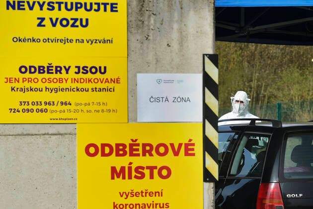 Paramedics take samples for covid-19 tests in drive-through testing station near the Domazlice Hospital, Czech Republic, on Wednesday, April 15, 2020. (CTKxPhoto MiroslavxChaloupka) CTKPhotoP202004150412101 cha004