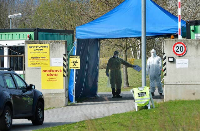 Paramedics take samples for covid-19 tests in drive-through testing station near the Domazlice Hospital, Czech Republic, on Wednesday, April 15, 2020. (CTKxPhoto MiroslavxChaloupka) CTKPhotoP202004150453401 cha008