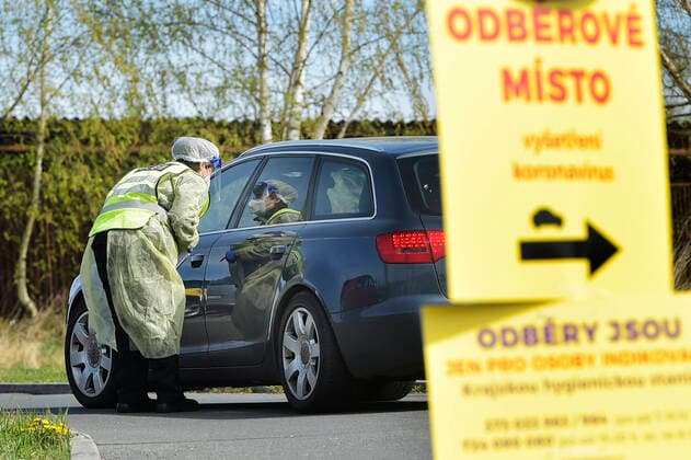Paramedics take samples for covid-19 tests in drive-through testing station near the Domazlice Hospital, Czech Republic, on Wednesday, April 15, 2020. (CTKxPhoto MiroslavxChaloupka) CTKPhotoP202004150456601 cha014