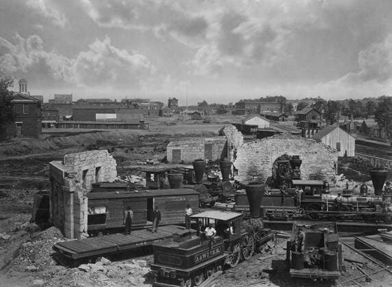 19th century photo showing the ruins of Atlanta city™s railroad roundhouse just after the American Civil War. Despite being a relatively small town in Georgia, Atlanta assumed a position of importance during the Civil War owing to being a rail and commerce hub. Photo taken in 1866 by George Barnard. Copyright: VernonxLewisxGallery StocktrekxImages JPA500379A