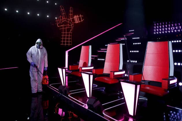 MOSCOW, RUSSIA - APRIL 16, 2020: A worker in a protective suit disinfecting the studio of The Voice Kids Russia reality TV singing competition ahead of a live broadcast scheduled for April 17; the shooting will be held without spectators and with the fewest possible members of the crew. Artyom Geodakyan TASS  TS0D60E8
