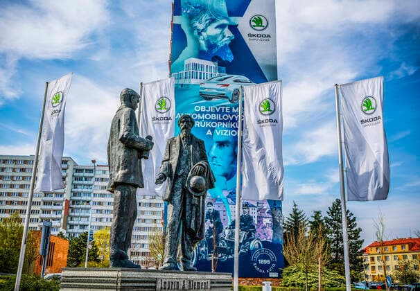 Flags of Czech carmaker Skoda Auto fly in the wind behind statue of Laurin & Klement, co-founders of the company, in front of company s museum in Mlada Boleslav, Czech Republic, on Thursday, April 16th, 2020. (CTKxPhoto RenexFluger) CTKPhotoF202004170418601 rfl