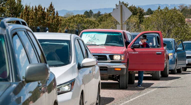 April 17, 2020, USA: Pat D Andrea, from Santa Fe, takes part in a group protesting from their vehicles outside the Governor s Mansion in Santa Fe, Friday April 17, 2020. The protest that consist of 13 vehicles were there to send a message to the Governor to release all the inmates from the jails and prisons in the state due to the COVID-19 outbreak. They are also asking her to put pressure on ICE to release immigrants from detention. USA - ZUMAab1_ 20200417_zaf_ab1_004 Copyright: xEddiexMoorex