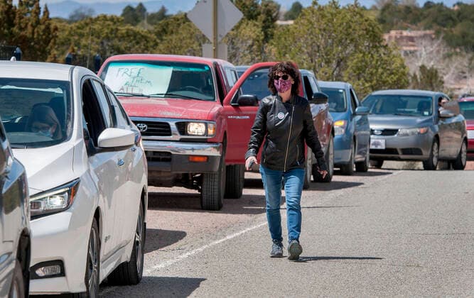 April 17, 2020, USA: Gaile Herling, with Bend the Arc New Mexico, leads a group protesting from their vehicles outside the Governor s Mansion in Santa Fe, Friday April 17, 2020. The protest that consist of 13 vehicles were there to send a message to the Governor to release all the inmates from the jails and prisons in the state due to the COVID-19 outbreak. They are also asking her to put pressure on ICE to release immigrants from detention. USA - ZUMAab1_ 20200417_zaf_ab1_003 Copyright: xEddiexMoorex
