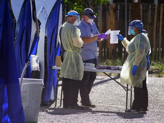 April 19, 2020, Albuquerque, NEW MEXICO, USA: 041920 ..Medical personnel performs a drive-thru Coronavirus Screening at Lovelace Hospital in Downtown Albuquerque l.Photographed on Sunday April 19, 2020.Adolphe Pierre-LouisJournal. Albuquerque USA - ZUMAab1_ 20200419_zaf_ab1_002 Copyright: xAlbuquerquexJournalx