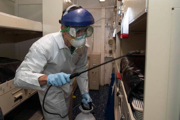 April 12, 2020, Apra Harbor, Guam, United States: A U.S. Navy sailor disinfects a bunks aboard the aircraft carrier USS Theodore Roosevelt to stop the spread of COVID-19, coronavirus at Naval Base Guam April 12, 2020 in Apra, Guam. Theodore Roosevelt sailors were moved to local hotels in an effort to minimize the spread of COVID-19. Apra Harbor United States - ZUMAp138 20200412_zaa_p138_005 Copyright: xKayliannaxGenier NationalxGuardx