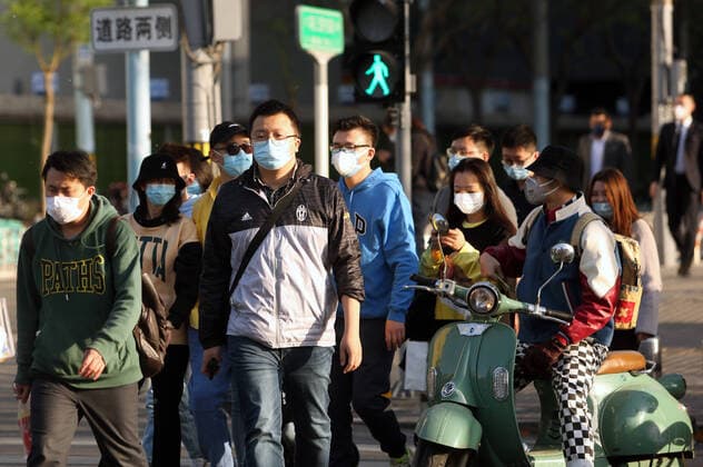 Chinese no longer practice safe social distancing but continue to wear protective face masks outside even though the government has declared the threat of the Covid-19 outbreak basically finished in Beijing on Tuesday, April 21, 2020. China has refuted charges from U.S. intelligence officials that it concealed the true extent of its coronavirus outbreak, although multiple revisions to its epidemic data have fueled mistrust both at home and from other countries.  PEK2020042103 STEPHENxSHAVER