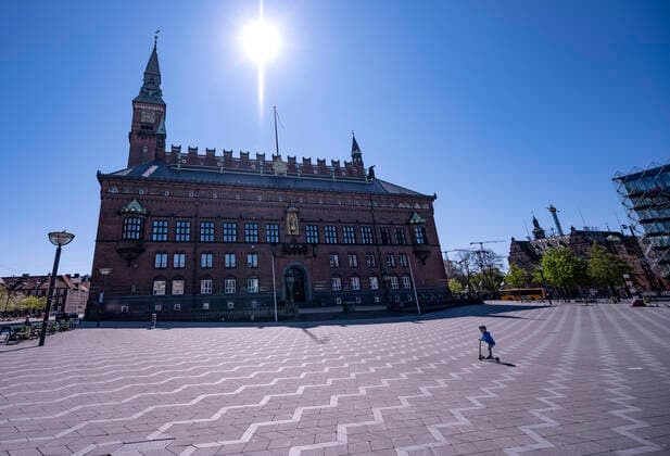 A little boy on a scooter crossing a nearly empty Radhusplatsen in Copenhagen as Denmark is slowly opening up after the coronavirus lockdown, April 21, 2020 COPENHAGEN DENMARK EBF x50090x,  Copyright: xJohanxNilsson TTx DENMARK CORONA