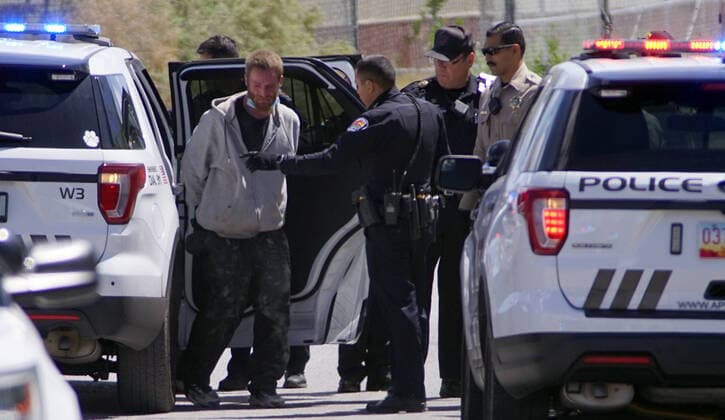 April 22, 2020, Albuquerque, NEW MEXICO, USA: 042220 ..APD officers and BCSO deputies take into custody a suspect in a shooting at Central and Unser NW .Photographed on Wednesday April 22, 2020.Adolphe Pierre-LouisJournal. Albuquerque USA - ZUMAab1_ 20200422_zaf_ab1_012 Copyright: xAlbuquerquexJournalx