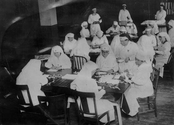 New York NEW YORK CITY, USA -- circa 1919 -- Back on the Job.Red Cross women at the New York County Chapter at the workroom at 82nd street and Amsterdam Ave, New York, USA, turning out medical supplies and hospital equipment to be used by the city health department in its war on influenza. So complete was the organization of chapter units, that the first call for supplies enabled the Red Cross to mobilize its workers immediately and the seven health zones designated by the Health Department have been kept steadily reinforced with necessities. Throughout the 216 chapters of the Atlantic Division and everywhere else in the country, Red Cross women are cooperating with the health officials in the present emergency. The Spanish Flu - as it commonly became known - infected around 500 million people around the world and led to the deaths of bet  EP_ATL 