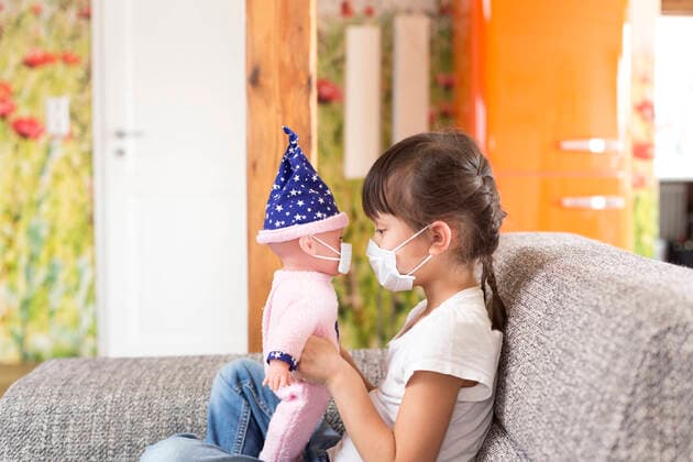Girl wearing mask at home model released Symbolfoto property released DRF01758