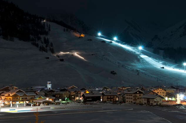 Ski village night scenario Ski village at night with slope lights, cross-country ski run, buildings, ice monument - shot in Livigno, Italian Alps  Copyright: xfranky242x 738444